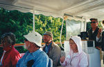 Ted Below and other guests sit aboard a boat tour in Fort Pierce, Florida