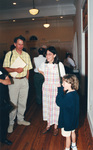 Jim Cox stands beside Katy NeSmith and a child at a Florida Ornithological Society meeting in Fort Pierce, Florida by Florida Ornithological Society