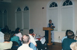 The audience listens as a speaker presents at a banquet in Fort Pierce, Florida