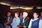 Mary Davidson, Peggy Powell, and Ted Below listen from the audience in Fort Pierce, Florida
