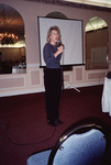 Camille Sewell speaks into a microphone at a Florida Ornithological Society meeting in Fort Pierce, Florida by Florida Ornithological Society