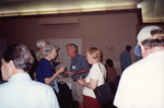Mary Davidson and Bob Brown mingle with other guests at a Florida Ornithological Society meeting in Fort Pierce, Florida by Florida Ornithological Society