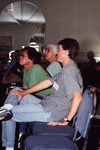 Eric Stolen sits beside Dean and Sally Jue during a presentation in Fort Pierce, Florida