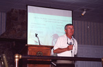 Sonny Bass faces the audience mid-presentation in Fort Pierce, Florida