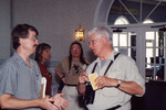 Eric Stolen speaks to a colleague while Billi Wagner has another conversation in the background, Fort Pierce, Florida