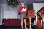 John Douglas speaks at a podium in Fort Pierce, Florida