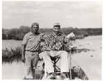Jesse Redding and Sam Brimes Perched Atop Boat in Broward County by Donald J. Nicholson