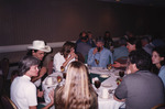 Julie Hovis and Chuck Hess Chat at Dinner Table During Florida Ornithological Society Meeting in Tallahassee by Florida Ornithological Society