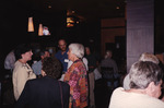 Group of Florida Ornithological Society Members Stands By Bar with TVs Overhead in Tallahassee by Florida Ornithological Society