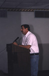 Speaker Stands Behind Podium at Florida Ornithological Society Meeting in Titusville by Florida Ornithological Society