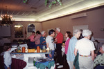 Guests Mingle Around Snack Table at Florida Ornithological Society Meeting in Fort Pierce by Florida Ornithological Society