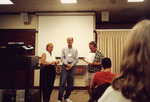 Ann Paul and Peter Merritt Look into Distance During Florida Ornithological Society Meeting in Fort Myers by Florida Ornithological Society
