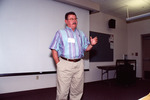 Sid Gauthreaux Gestures While Presenting in Front of Projector Screen in Fort Myers by Florida Ornithological Society