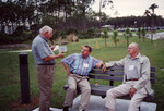 Sid Gauthreaux and Glen Woolfenden Listen from Bench As Another Guest Speaks in Fort Myers by Florida Ornithological Society