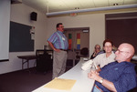 Sid Gauthreaux Stands with Hands on Hips While Bill and Linda Cooper Look On in Fort Myers by Florida Ornithological Society
