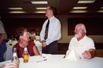 Linda and John Douglas Smile While Listening to Jerome Jackson Speak Behind Them in Fort Myers by Florida Ornithological Society