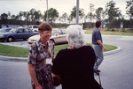 Pam Bowen and Marie Slaney Laugh Together While Joe Stewart Walks Away in Fort Myers by Florida Ornithological Society