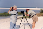 Ed Slaney Observes Through Binoculars While Dave Goodwin Consults Camera in St. Petersburg by Florida Ornithological Society