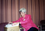 Woman Digs Through Box of Pamphlets During Florida Ornithological Society Meeting in St. Petersburg by Florida Ornithological Society