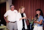 Three Guests Chat Engagedly Beside Vase of Bird of Paradise Flowers in St. Petersburg by Florida Ornithological Society