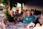 Unnamed Couple Sits on Waterside Patio at Florida Ornithological Society Meeting in St. Petersburg by Florida Ornithological Society