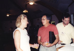 Camille Yates Speaks with Dean Jue While Joe Stewart Stands Nearby in Marathon, Florida by Florida Ornithological Society