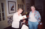 Ann Paul Writes in Notebook While Cynthia Plockelman Looks On in Clewiston by Florida Ornithological Society