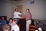 Peter Merritt and Glen Woolfenden Exchange Book and Handshake in Clewiston by Florida Ornithological Society