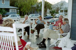 Brooks Atherton, Lyn Atherton, Marvin Collins, and Rick West Converse on Porch by Pamela J. Bowen