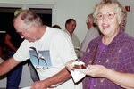 Ned and Teddy Shuler Serve Themselves Snacks in Apalachicola, Florida by Pamela J. Bowen