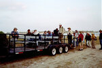 Birders Stepping Onto Tractor Transport by Pamela J. Bowen