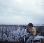 Dave Goodwin Uses Spotting Scope at Merritt Island National Wildlife Refuge by Unknown