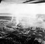 Pollution rising from smoke stacks at a cement plant, view 2 by Skip Gandy