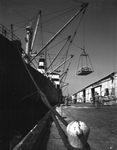Unloading sacks with a ship's boom by Skip Gandy