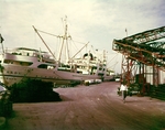 Unloading cargo with ship's boom A by Skip Gandy
