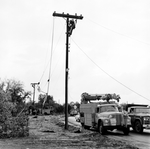 Repairing powerlines after tornado by Skip Gandy