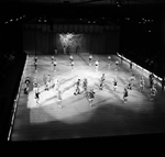 Ice skating troupe performing a routine by Skip Gandy