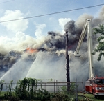 Old Emilio Pons cigar factory in flames and fire truck by Skip Gandy