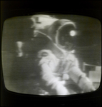 Light glints off an astronaut's helmet during the Apollo 15 lunar landing mission
