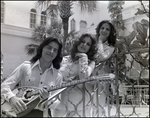 The three-sibling band The Fremis poses on a Mediterranean patios, B