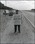 An Alfred S. Austin Construction Company employee strikes for wages and working conditions in Tampa, Florida, B