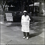 An Afred S. Austin Construction Company employee goes on strike outside his sub-contractor workplace in Tampa, Florida, B