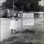 An Afred S. Austin Construction Company employee strikes outside the company's entrance in Tampa, Florida, A