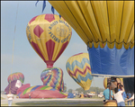A balloon from Rosie O'Grady's Flying Circus begins to rise at the Harbour Island Balloon Regatta in June in Tampa, Florida