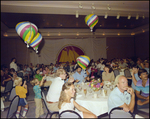 Guests dine and children play with balloons during the Harbour Island Balloon Regatta in Tampa, Florida