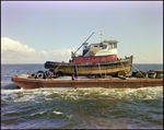 A dredging barge belonging to Baycon Industries, Incorporated in Tampa, Florida, B