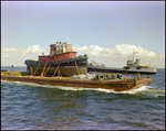 A dredging barge belonging to Baycon Industries, Incorporated in Tampa, Florida, D