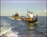A dredging barge belonging to Baycon Industries, Incorporated in Tampa, Florida, G