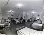 Nurses tend to patients and family members inside Bay Pines Veterans Affairs (V.A.) Hospital in St. Petersburg, Florida by Skip Gandy