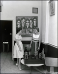 Two women chat beside an oversized chess set at Bern's Steak House in Tampa, Florida